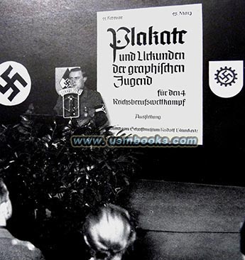 Arthur Axmann in front of a Nazi poster designed for the 4th Youth Career Competition